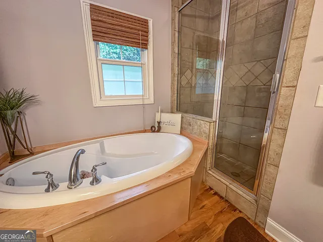 a bedroom with a bed a table and chair