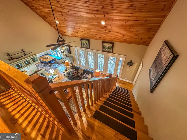 a kitchen with stainless steel appliances granite countertop a refrigerator and a cabinets