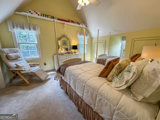 a bedroom with a bed and a table