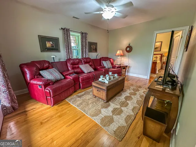 an aerial view of a house with swimming pool a yard and deck