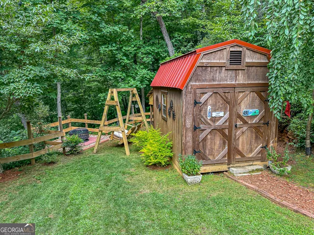 a house view with a sitting space and garden