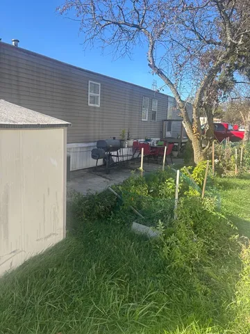 a backyard of a house with seating space
