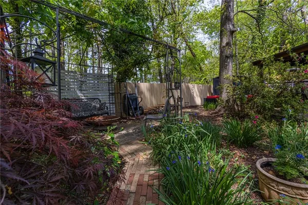 a view of back yard with porch and outdoor seating