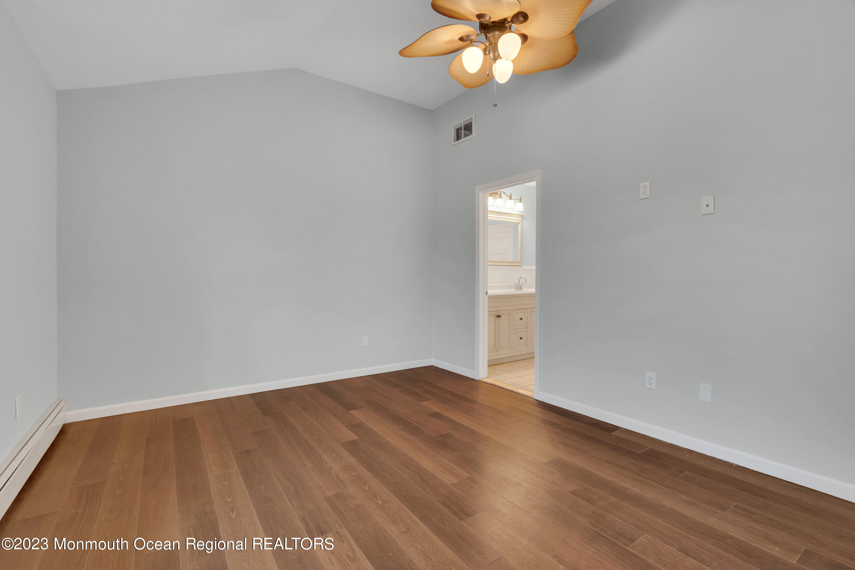 1007 Beaver Dam Road Point Pleasant, NJ 08742 - Photo 28 of 45 a view of an empty room with a chandelier fan