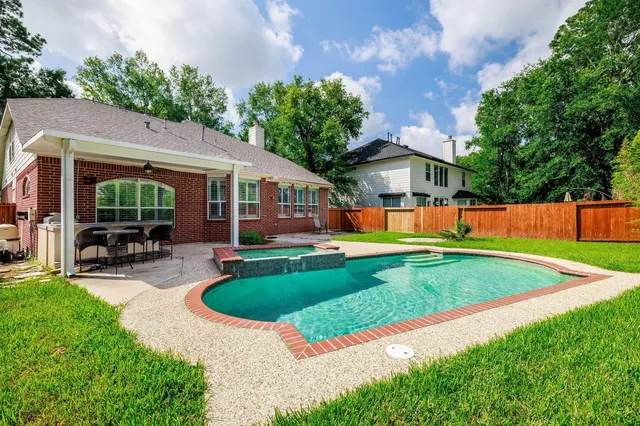 a view of a house with a yard patio and a patio