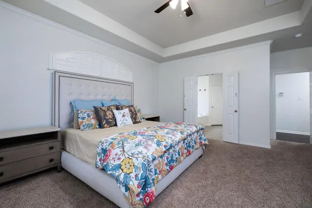 a bedroom with bed and a window