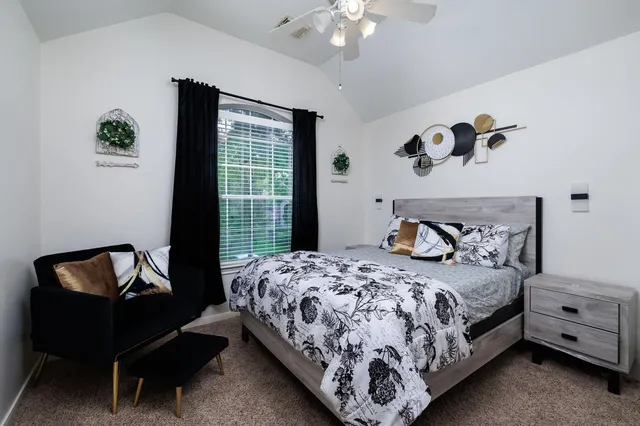 a bedroom with a bed and a window