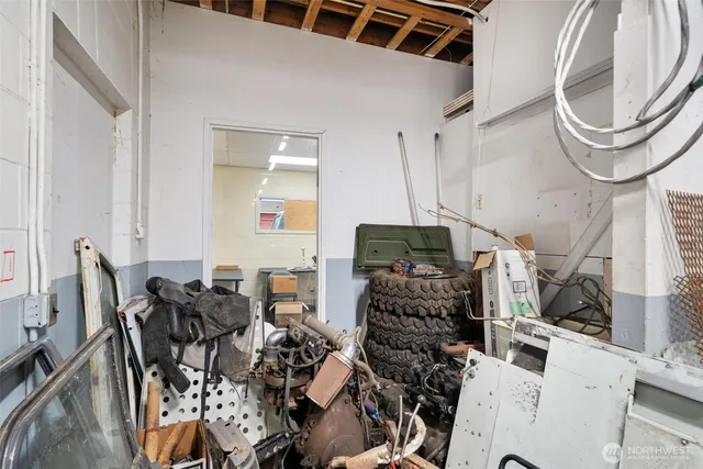a picture of a living room with furniture and a fireplace