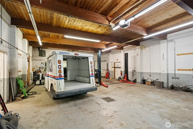 a view of the room with wooden floor and furniture