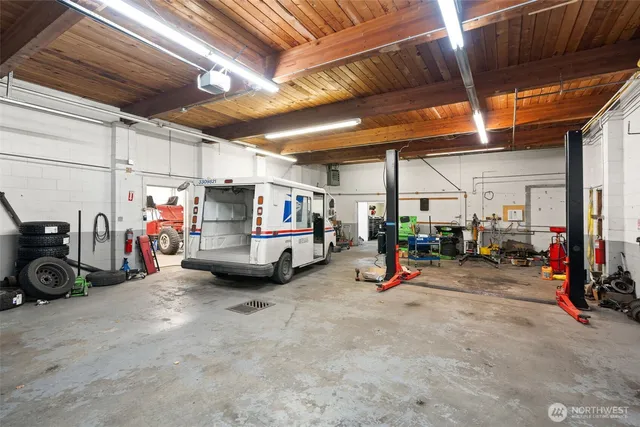 a view of a garage with rack and bicycle