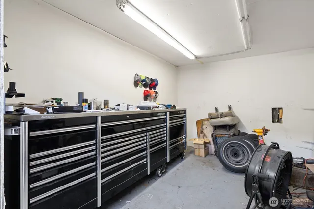 a utility room with dryer washer and other items