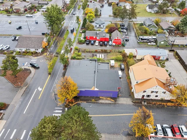 an aerial view of a houses with yard
