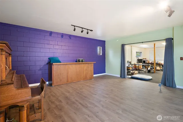 a view of livingroom with furniture and cars