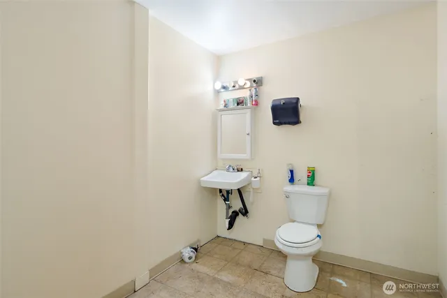 a bathroom with a toilet and a sink