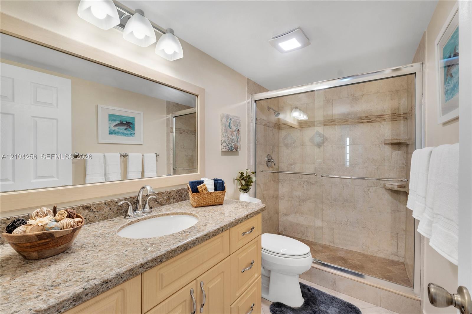 10777 West Sample Road, Unit 907 Coral Springs, FL 33065 - Photo 4 of 45 Guest Bathroom
