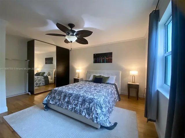 a bedroom with a bed and a walk in closet