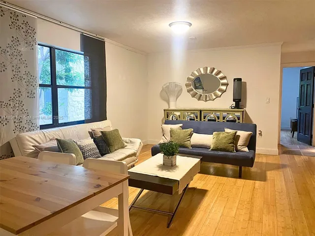 a living room with furniture and a window