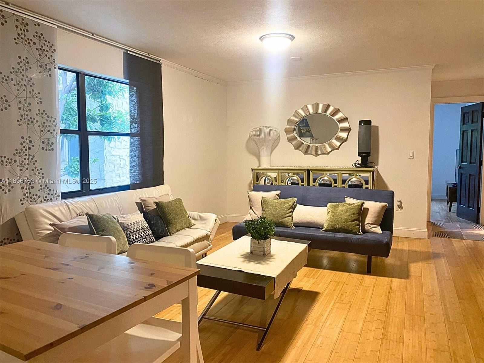 753 Michigan Avenue, Unit 2B Miami Beach, FL 33139 - Photo 3 of 22 a living room with furniture and a window