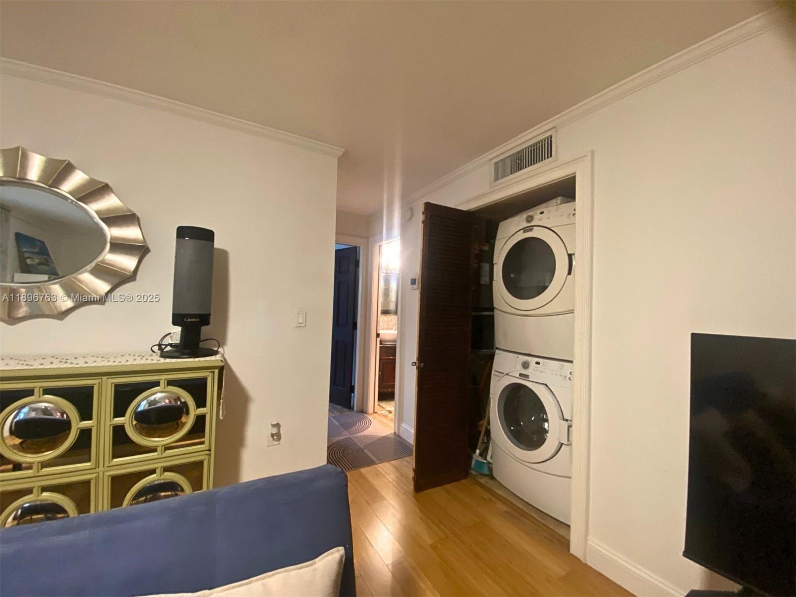 753 Michigan Avenue, Unit 2B Miami Beach, FL 33139 - Photo 8 of 22 a utility room with dryer and washer