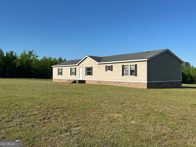 a house view with a backyard space