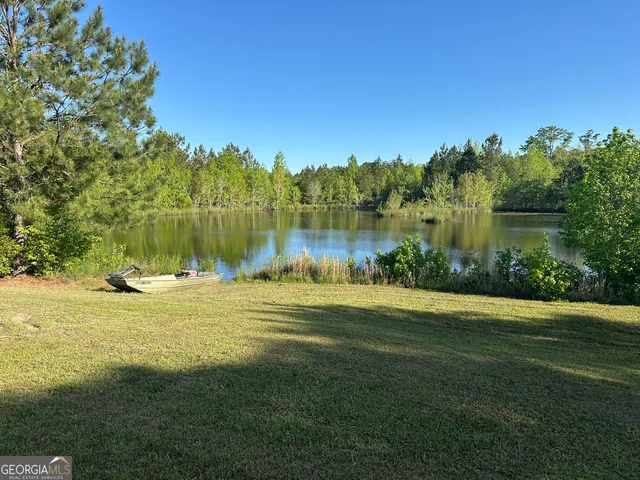 a view of a lake with a big yard