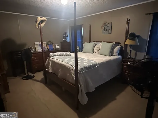 a bed room with a bed and furniture