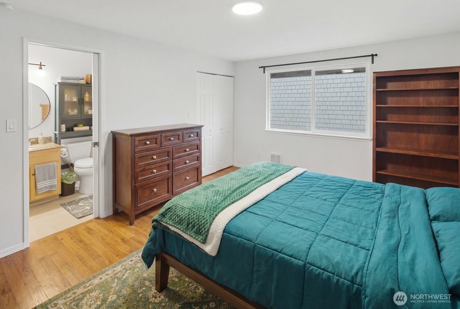 7431 212th Street Southwest, Unit 16 Edmonds, WA 98026 - Photo 12 of 22 a bedroom with a bed and a dresser