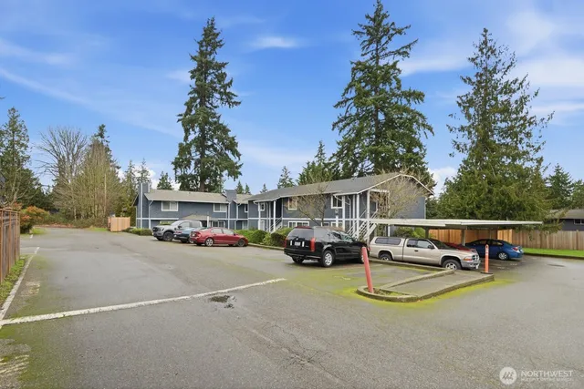 a view of a house with swimming pool and sitting area