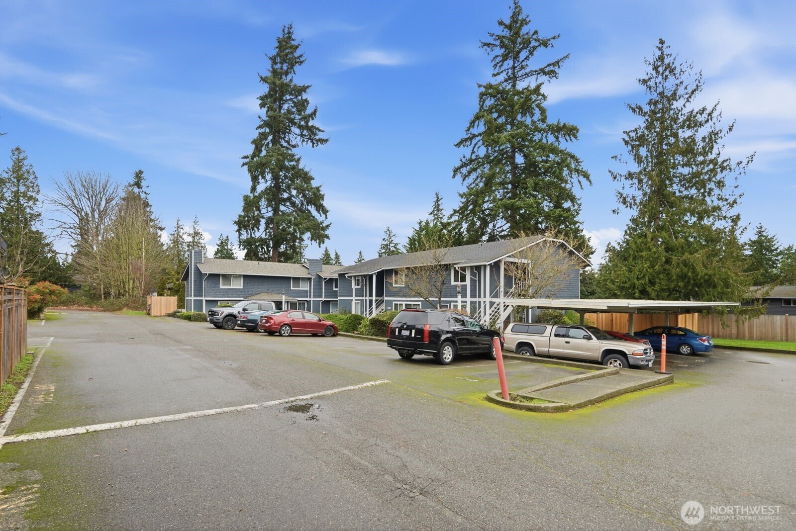 7431 212th Street Southwest, Unit 16 Edmonds, WA 98026 - Photo 19 of 22 a view of a house with swimming pool and sitting area