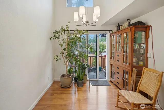 a view of an entryway with wooden floor and door