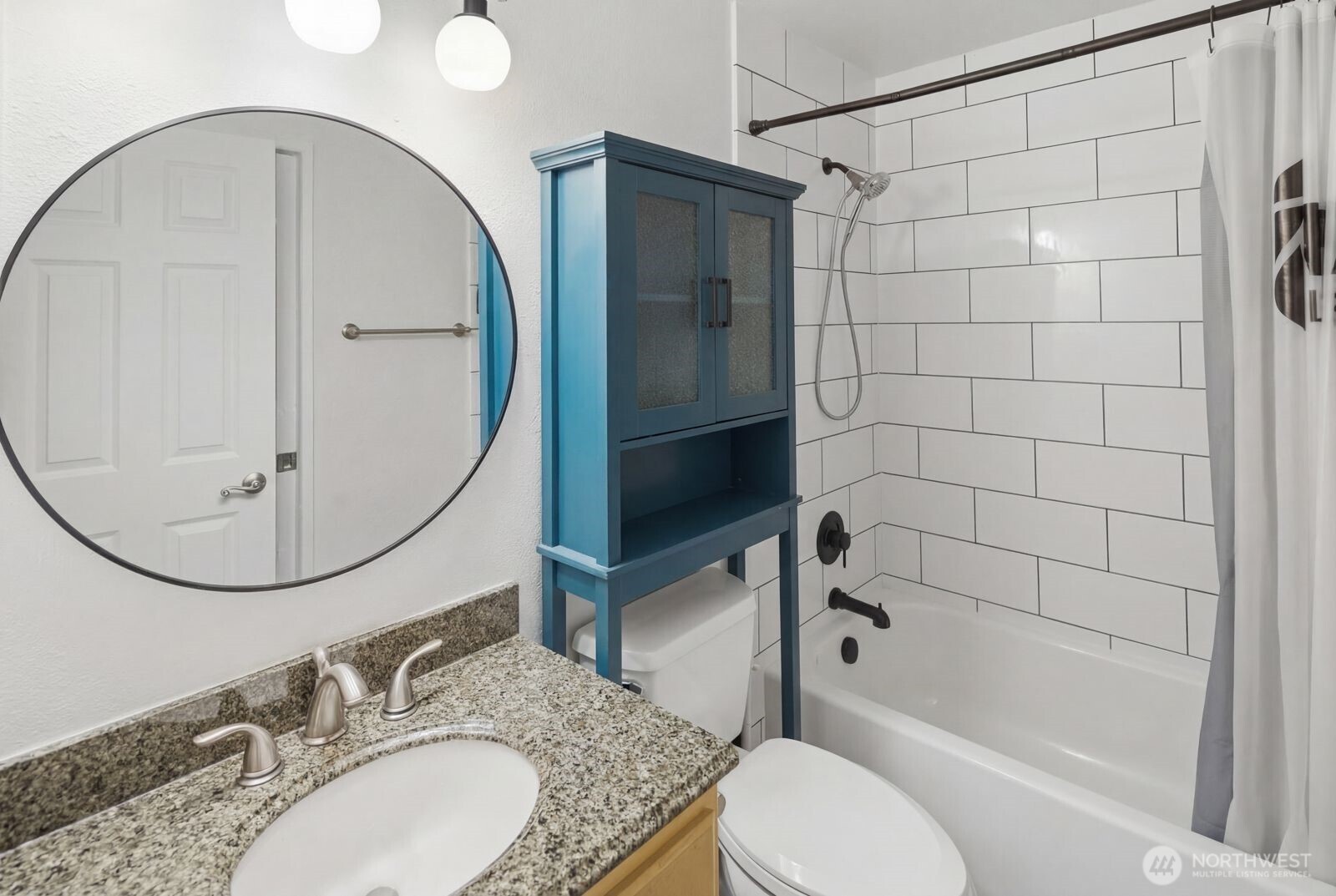 7431 212th Street Southwest, Unit 16 Edmonds, WA 98026 - Photo 9 of 22 a bathroom with a sink toilet and shower