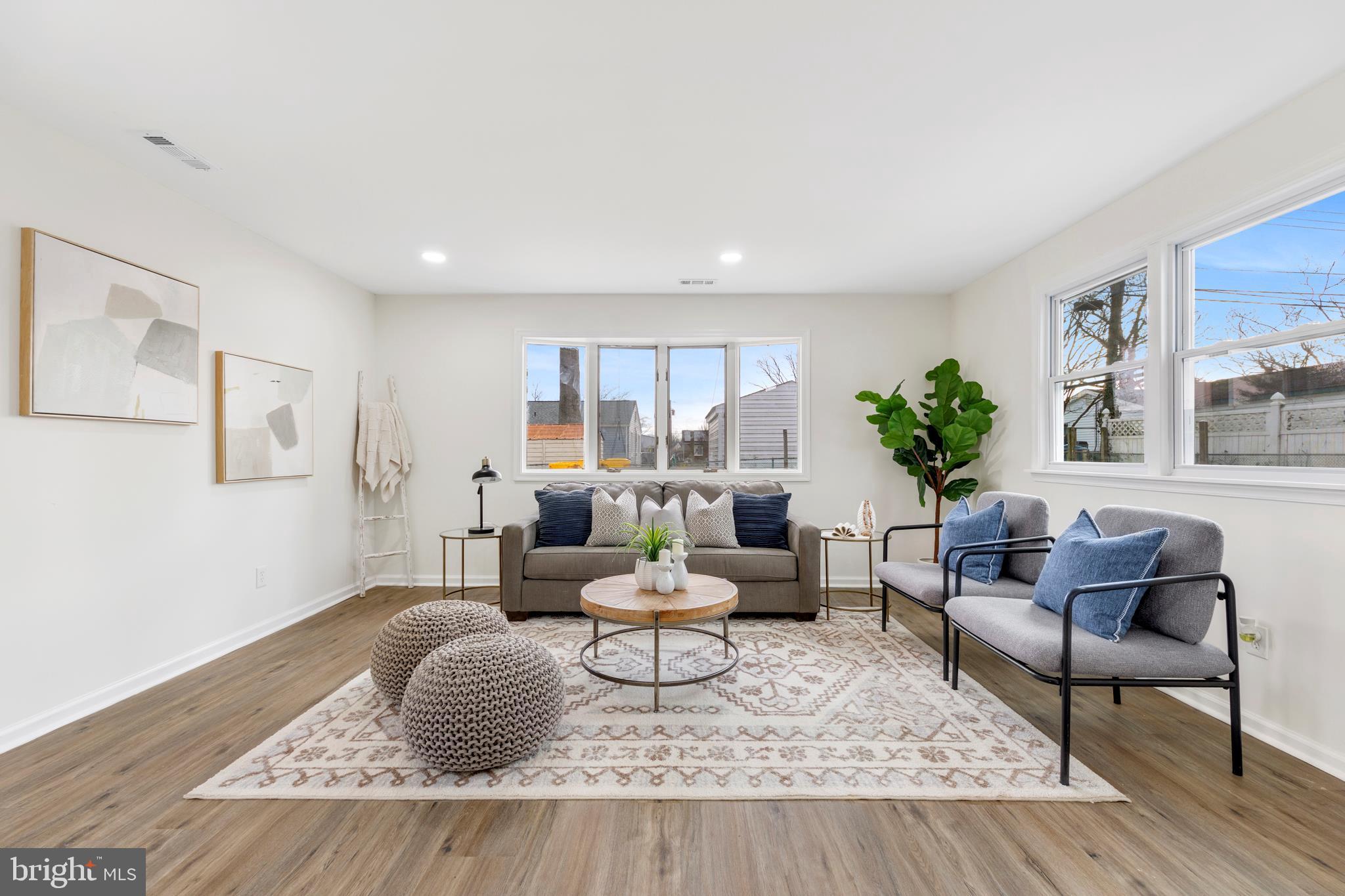 723 Cotter Road Glen Burnie, MD 21060 - Photo 15 of 31 a living room with furniture and a potted plant