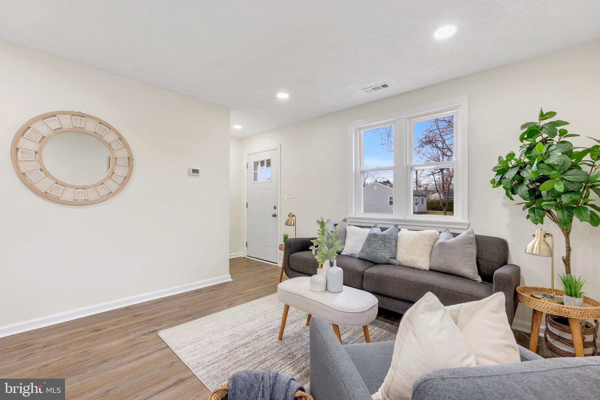 723 Cotter Road Glen Burnie, MD 21060 - Photo 16 of 31 a living room with furniture and a potted plant