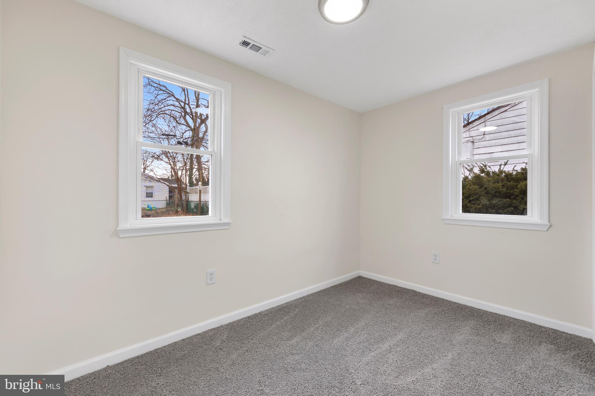 723 Cotter Road Glen Burnie, MD 21060 - Photo 21 of 31 an empty room with windows and closet