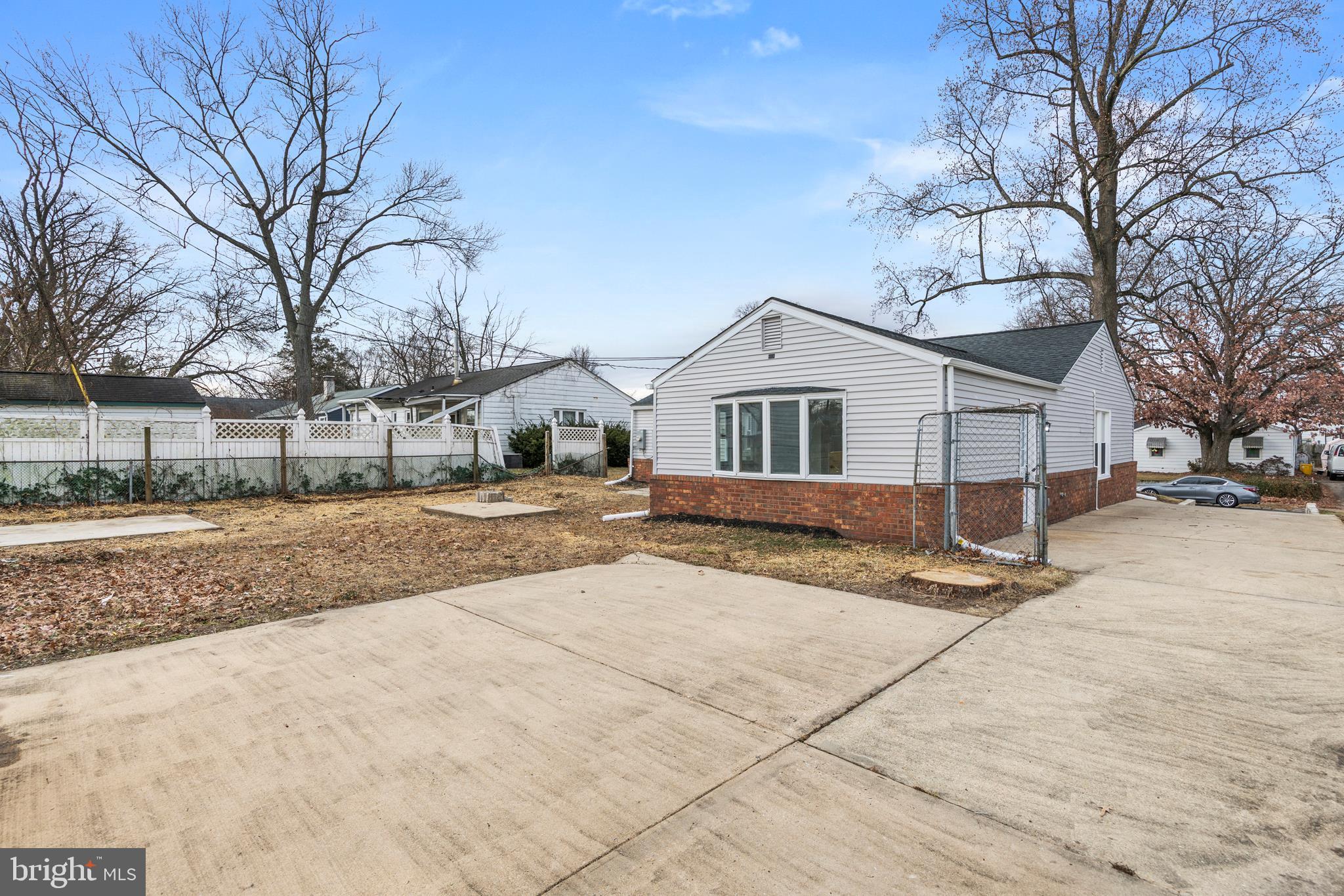 723 Cotter Road Glen Burnie, MD 21060 - Photo 29 of 31 a view of a white house with a snow on the road