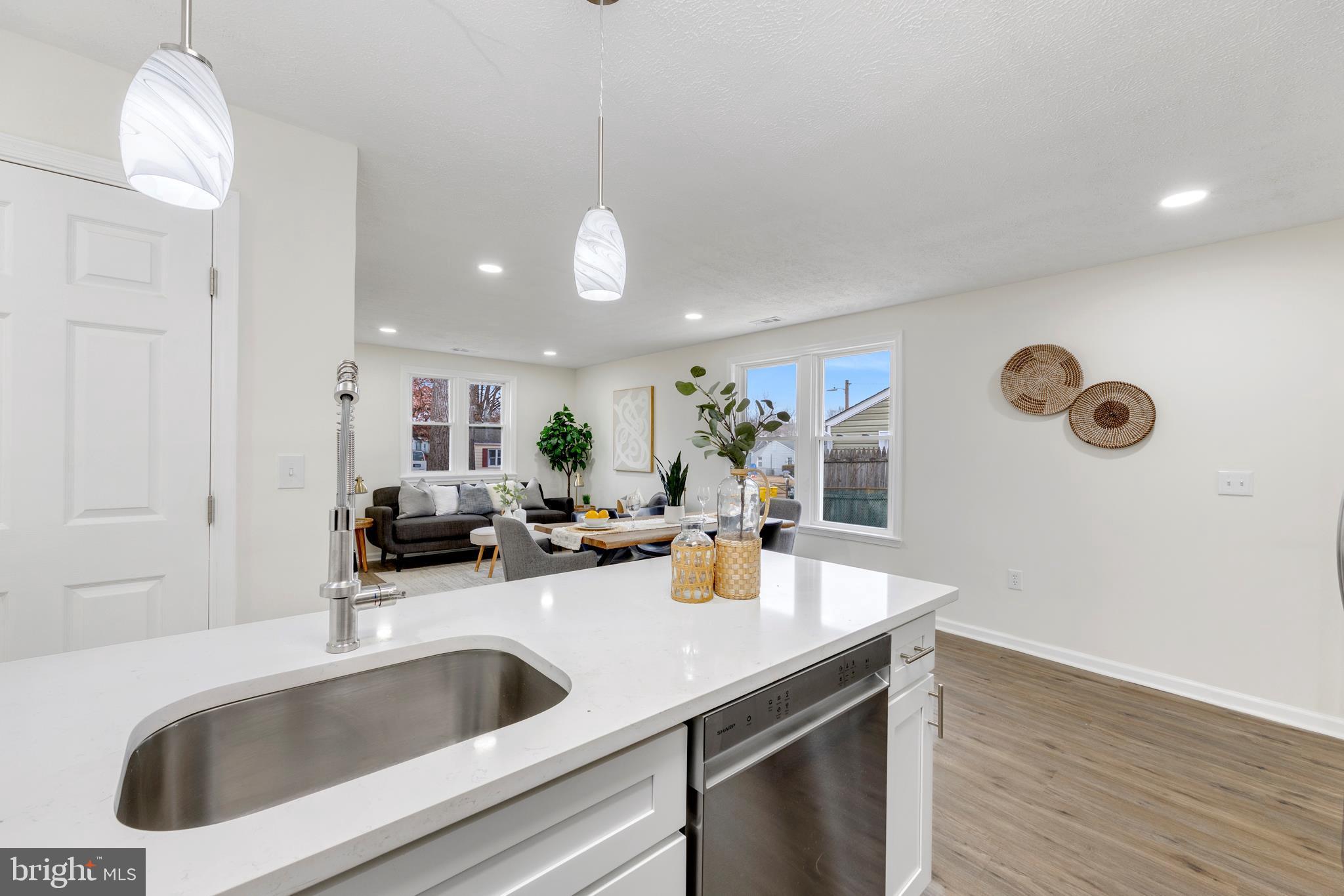 723 Cotter Road Glen Burnie, MD 21060 - Photo 7 of 31 a kitchen with a sink a counter and cabinets