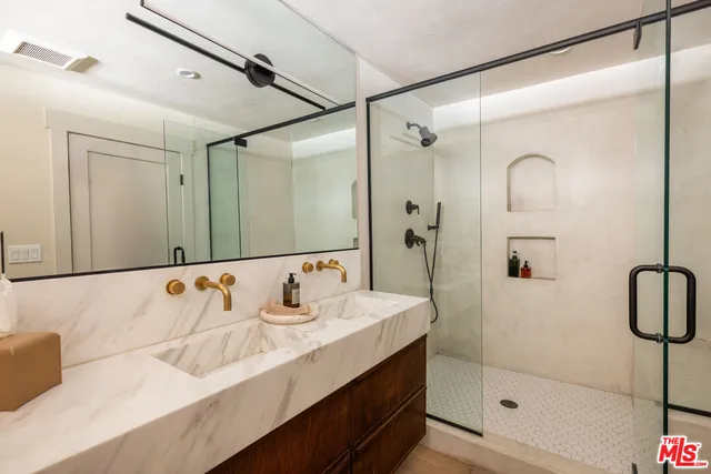 a bathroom with a bathtub and a shower
