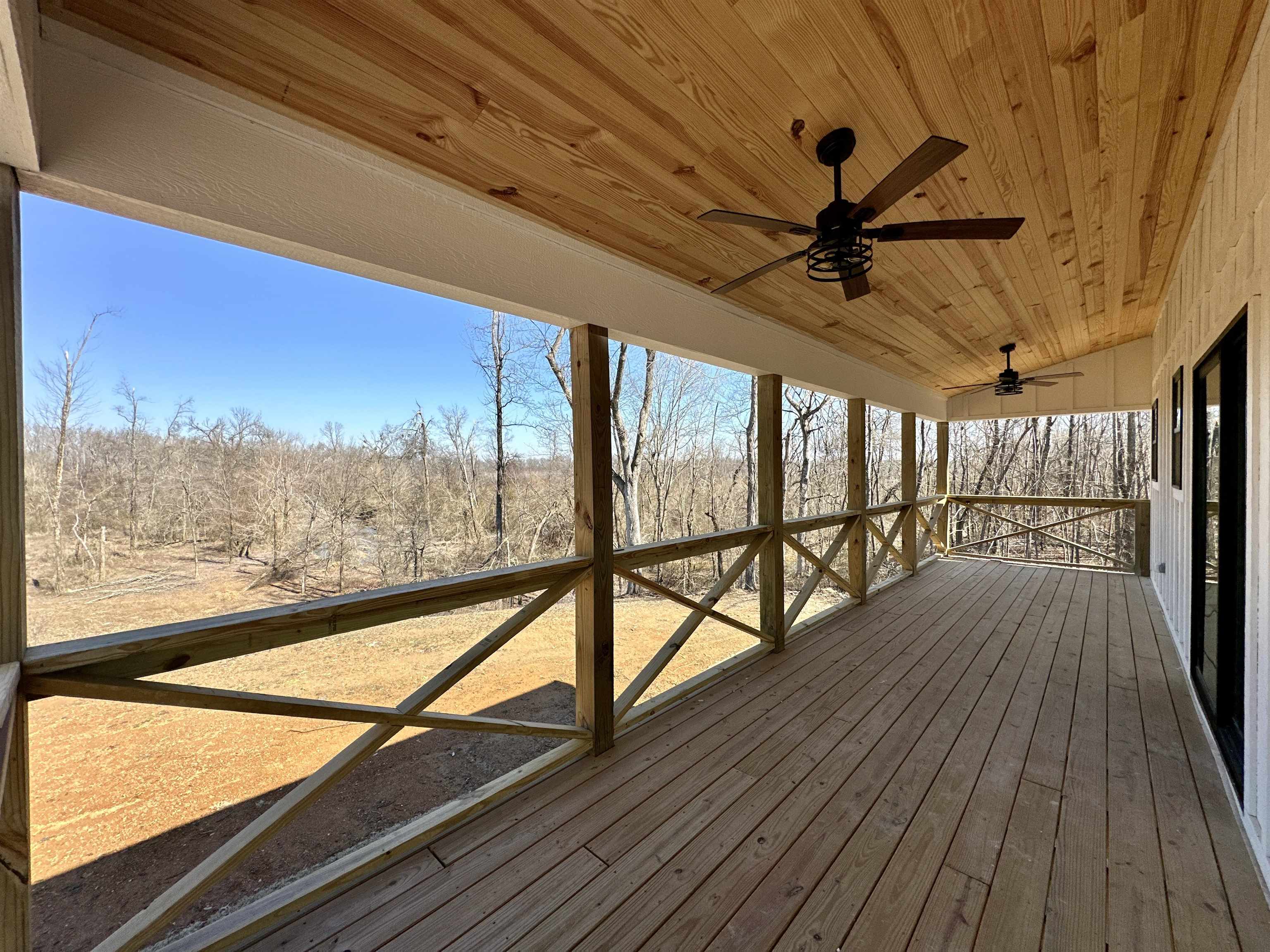 3840 Federal Road Counce, TN 38326 - Photo 2 of 40 Deck featuring a ceiling fan and a sunroom
