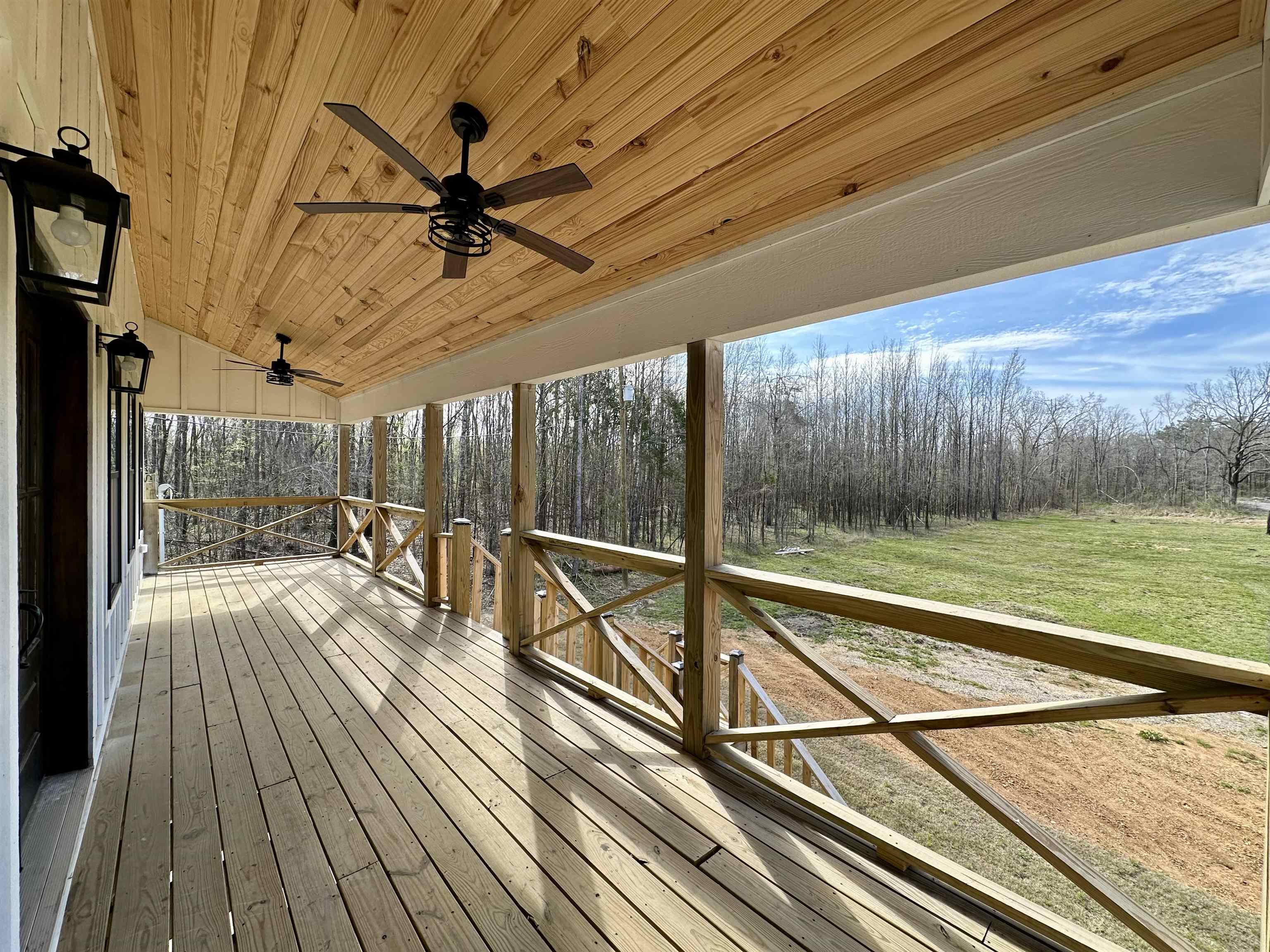 3840 Federal Road Counce, TN 38326 - Photo 6 of 40 Wooden terrace with a ceiling fan