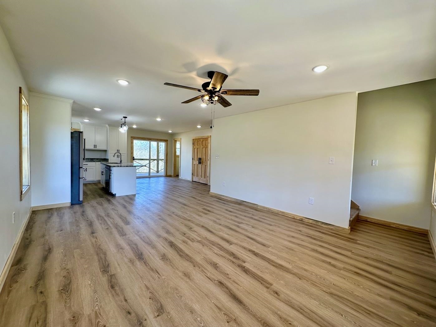 3840 Federal Road Counce, TN 38326 - Photo 7 of 40 Unfurnished living room with light wood finished floors, recessed lighting, and a ceiling fan