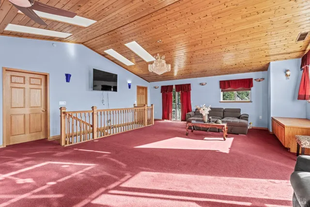 a lobby with furniture and large windows