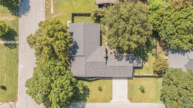 an aerial view of residential house with outdoor space