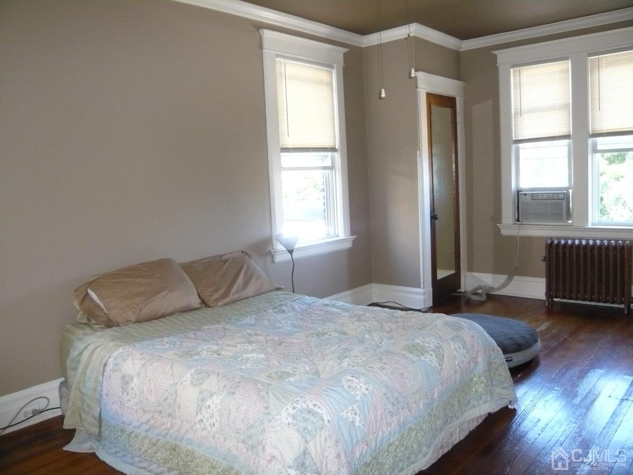 232 Rector Street Perth Amboy, NJ 08861 - Photo 19 of 31 a bedroom with a bed and a window