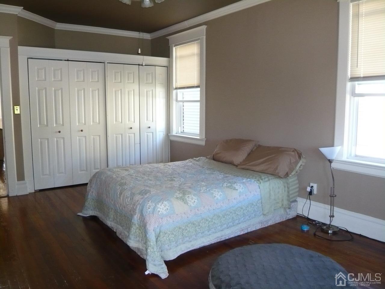 232 Rector Street Perth Amboy, NJ 08861 - Photo 20 of 31 a bedroom with a bed and a window