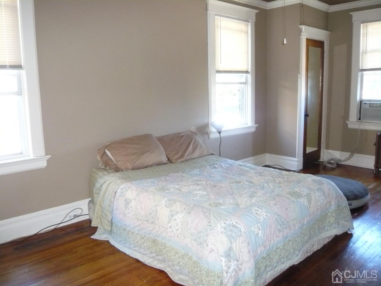 232 Rector Street Perth Amboy, NJ 08861 - Photo 21 of 31 a bedroom with a bed and a window