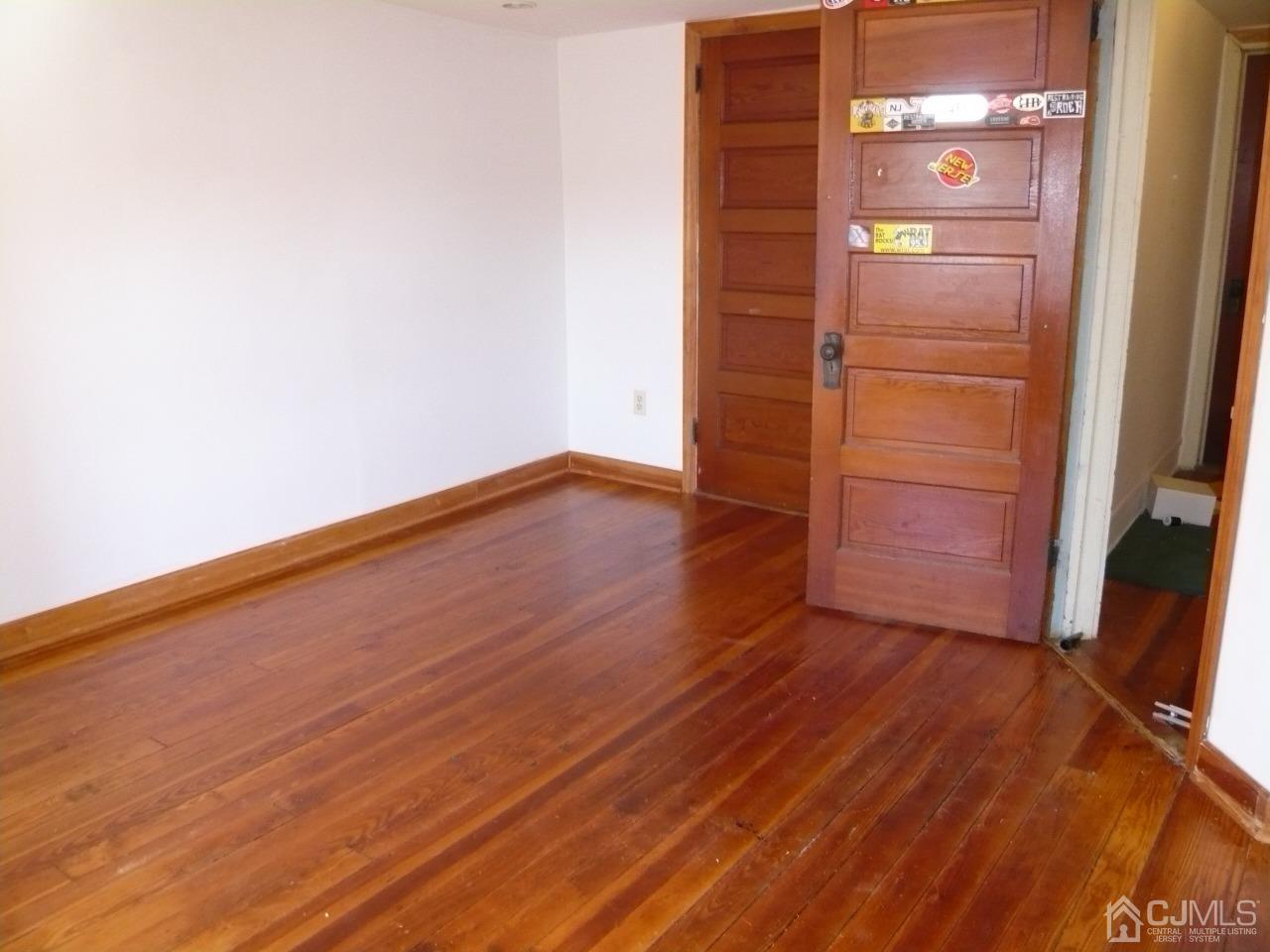 232 Rector Street Perth Amboy, NJ 08861 - Photo 23 of 31 a view of empty room with wooden floor