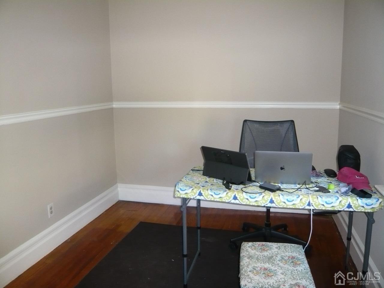 232 Rector Street Perth Amboy, NJ 08861 - Photo 28 of 31 a room with furniture and wooden floor