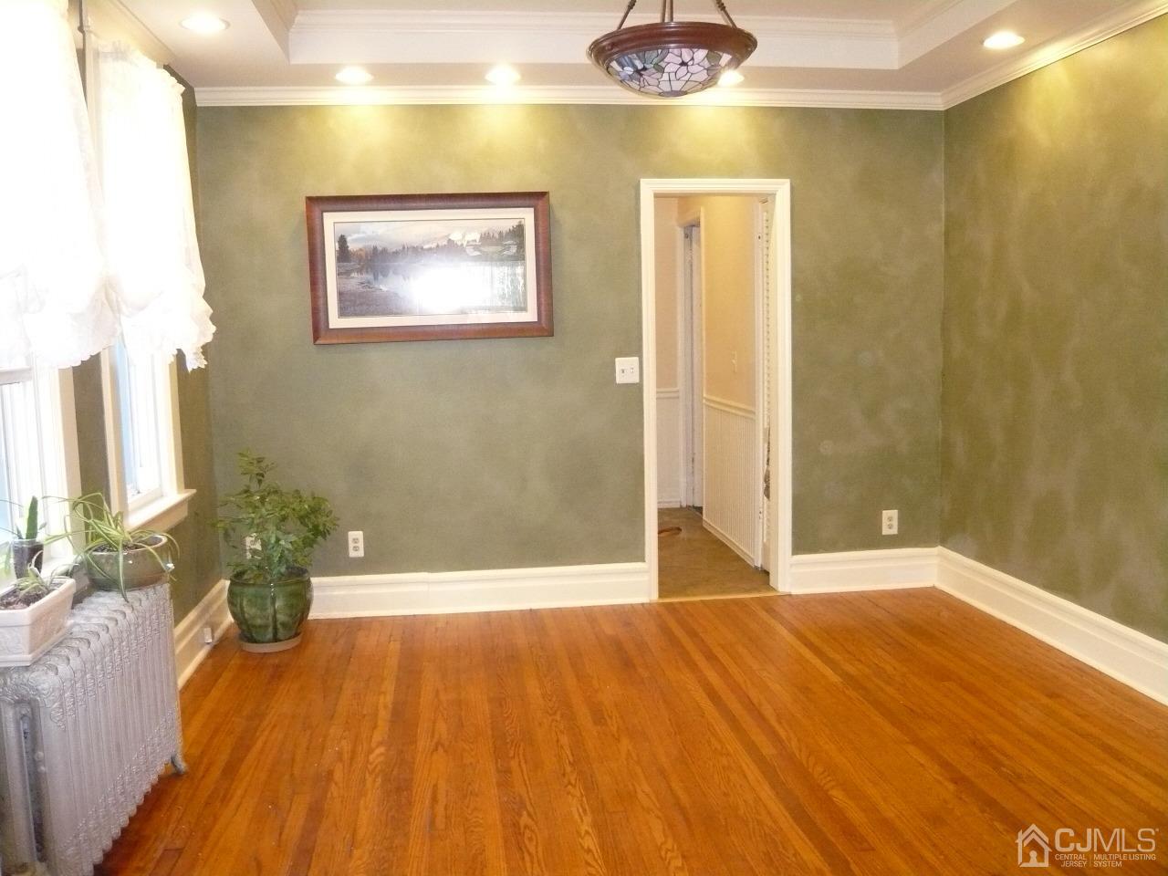 232 Rector Street Perth Amboy, NJ 08861 - Photo 10 of 31 a view of a room with wooden floor