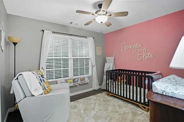 a bedroom with furniture and a window