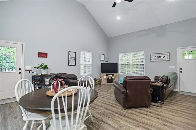 a view of a livingroom with furniture window and wooden floor